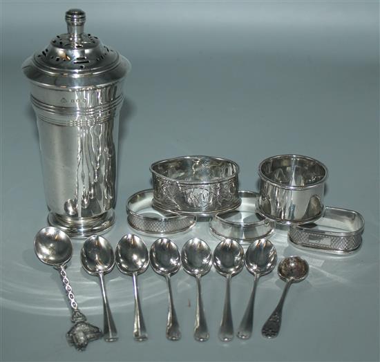 Silver cylindrical sugar caster, 5 silver napkin rings and 8 silver spoons, various